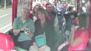 Charles Oropallo and Susan Oropallo on a tour bus on route to the Eiffel Tower on July 12, 2014. Photo through rear view mirror by Charles Oropallo.